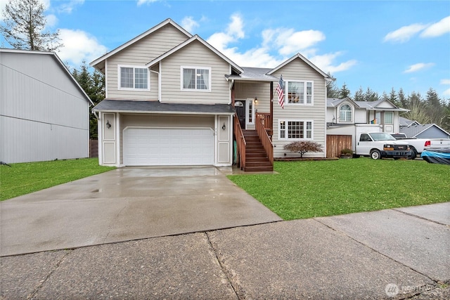 split foyer home featuring a shingled roof, concrete driveway, an attached garage, stairs, and a front lawn