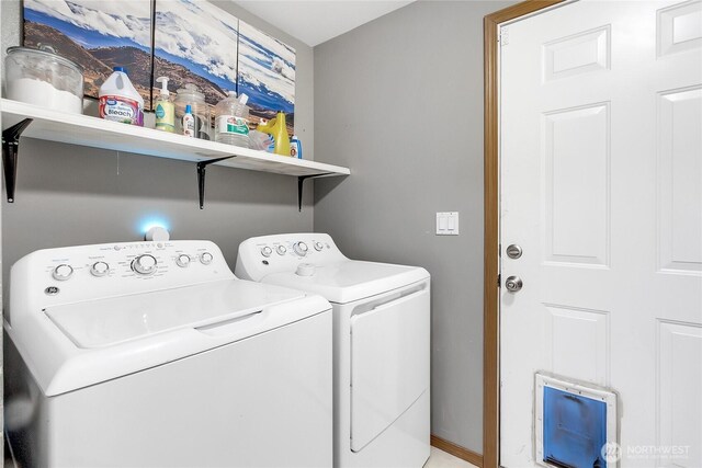 clothes washing area with washing machine and dryer and laundry area