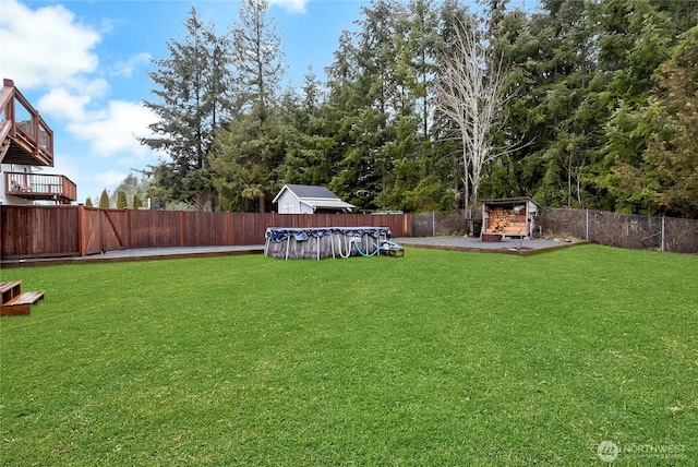 view of yard with a fenced backyard and a fenced in pool