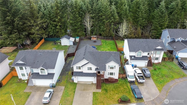 birds eye view of property with a residential view