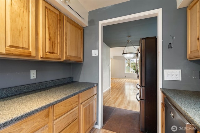 kitchen featuring appliances with stainless steel finishes, brown cabinetry, and dark countertops