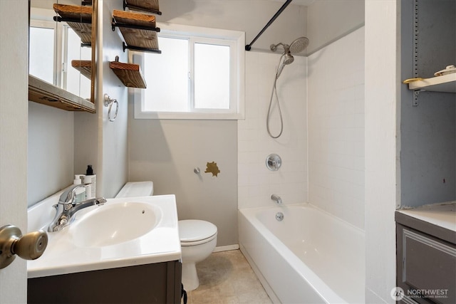 bathroom featuring toilet,  shower combination, and vanity