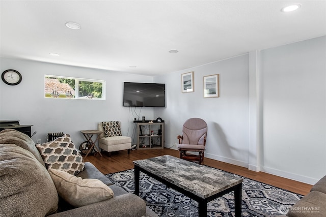 living room featuring baseboards, dark wood-style flooring, and recessed lighting