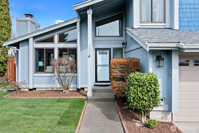 doorway to property with a lawn, a chimney, and a shingled roof