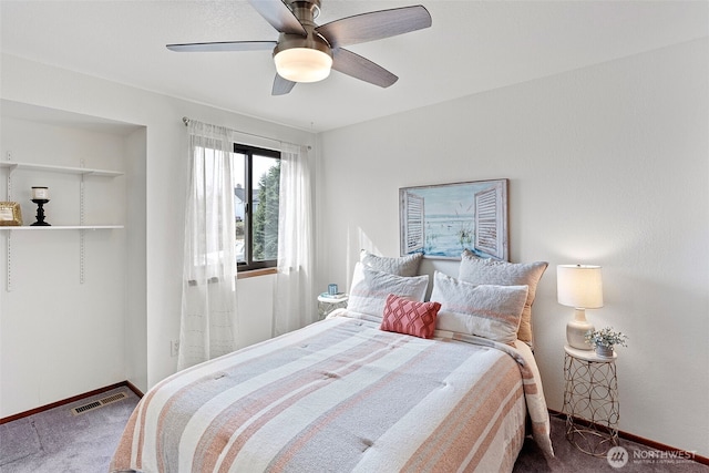 bedroom with visible vents, baseboards, a ceiling fan, and carpet flooring