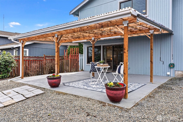 view of patio / terrace with fence and a pergola