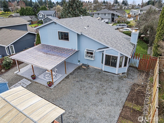 birds eye view of property with a residential view