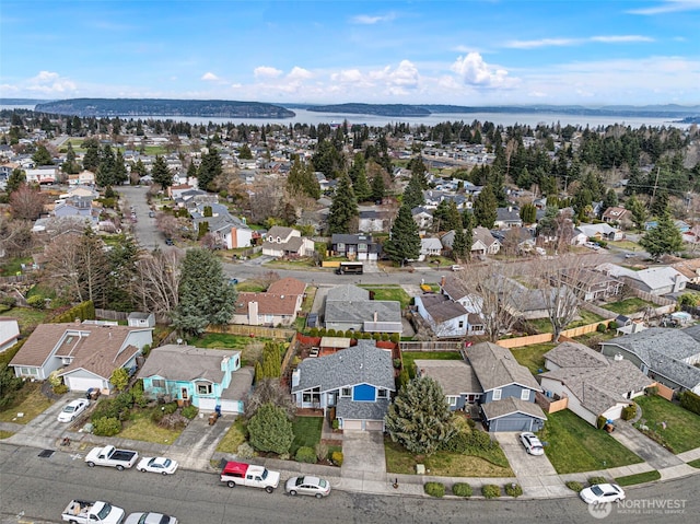 bird's eye view with a water view and a residential view