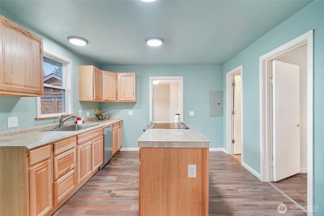 kitchen with a center island, dishwasher, a sink, and light brown cabinetry