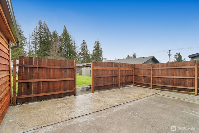 view of patio featuring fence