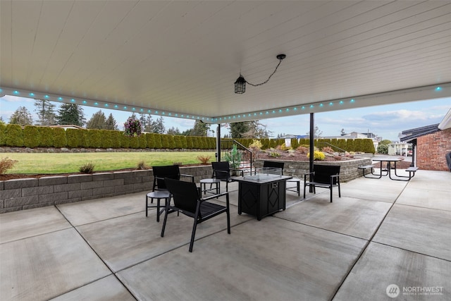 view of patio / terrace with an outdoor fire pit