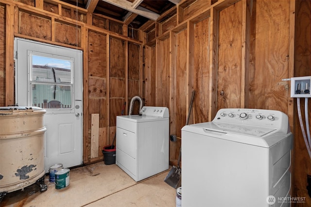 clothes washing area featuring laundry area and washing machine and clothes dryer