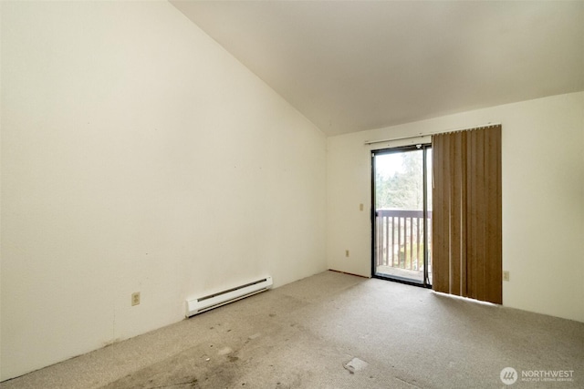 carpeted spare room featuring lofted ceiling and a baseboard heating unit