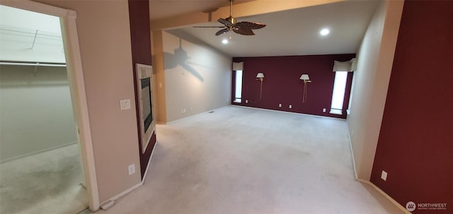 unfurnished room featuring ceiling fan, recessed lighting, light carpet, baseboards, and vaulted ceiling