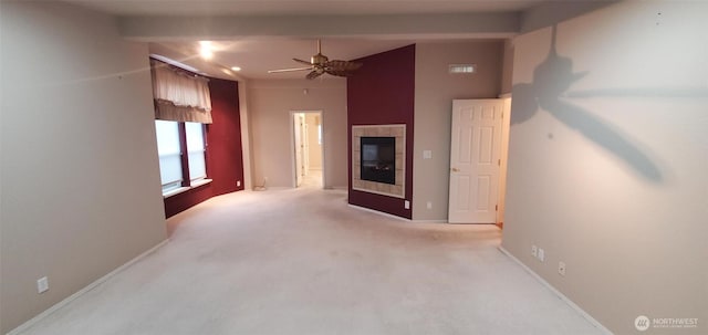 living room featuring visible vents, a tiled fireplace, light carpet, ceiling fan, and baseboards