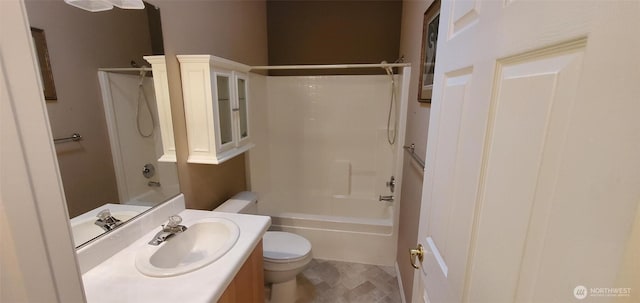 bathroom with toilet, shower / bathing tub combination, and vanity