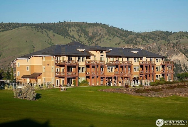 view of building exterior with a mountain view