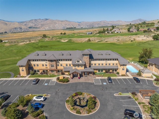 birds eye view of property with a mountain view