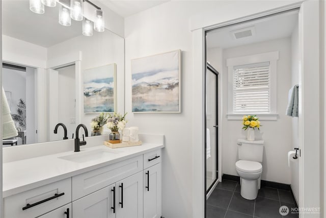 bathroom with visible vents, toilet, a shower stall, vanity, and tile patterned flooring