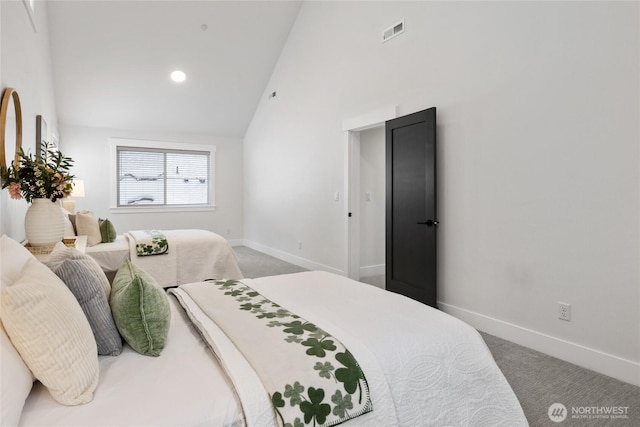 carpeted bedroom featuring high vaulted ceiling, visible vents, and baseboards