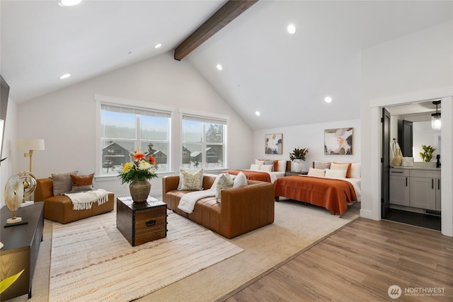 bedroom with ensuite bath, wood finished floors, high vaulted ceiling, beam ceiling, and recessed lighting
