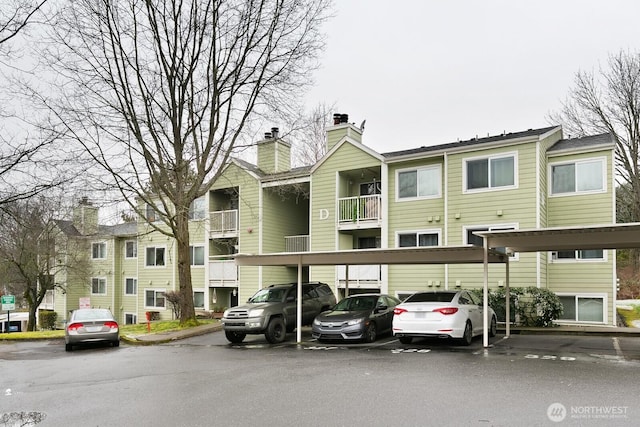 975 Aberdeen Ave NE Unit D203, Renton, WA 98056 - view of building exterior featuring covered parking
