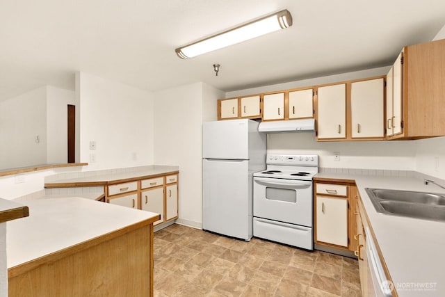 kitchen featuring under cabinet range hood, a peninsula, white appliances, a sink, and light countertops