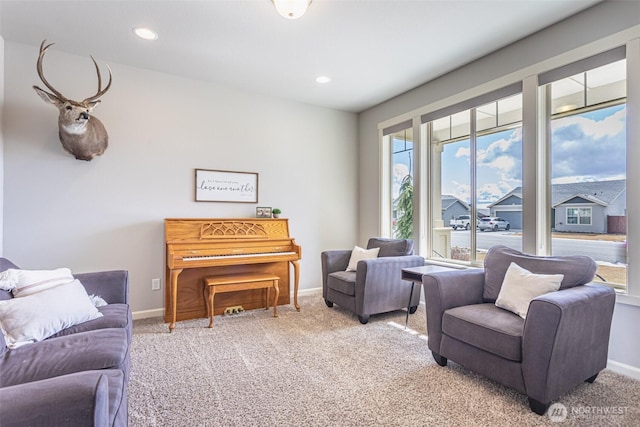 sitting room with carpet floors, baseboards, and recessed lighting