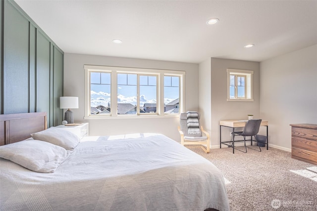 carpeted bedroom featuring baseboards and recessed lighting