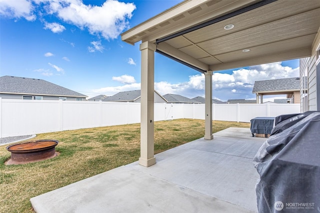 view of patio / terrace with an outdoor fire pit and a fenced backyard