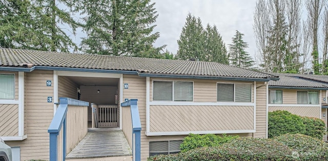 view of front of house featuring a tiled roof