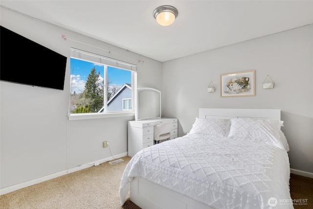 bedroom featuring visible vents and baseboards