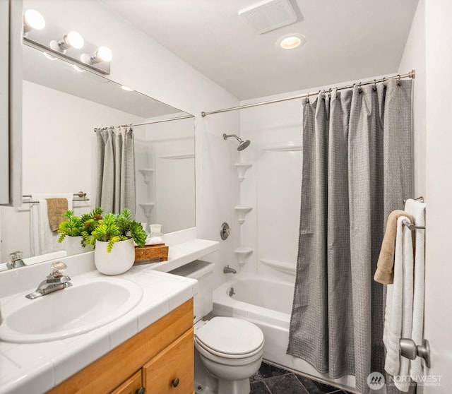 bathroom featuring toilet, shower / bath combo, vanity, and visible vents