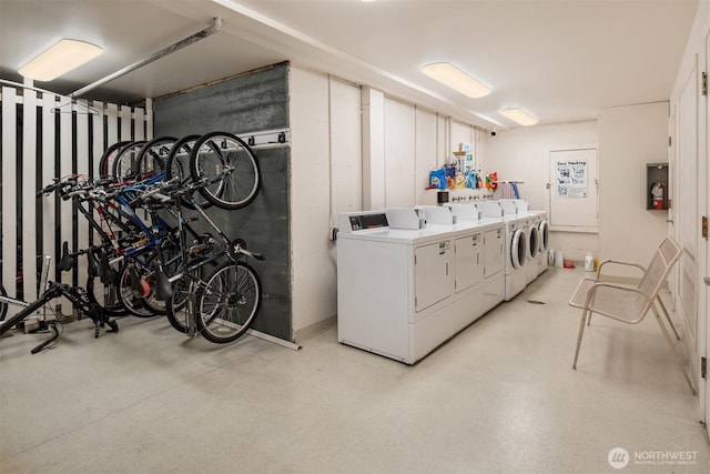 community laundry room with washer and clothes dryer