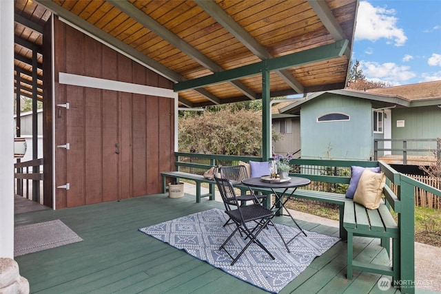 wooden deck featuring outdoor dining space