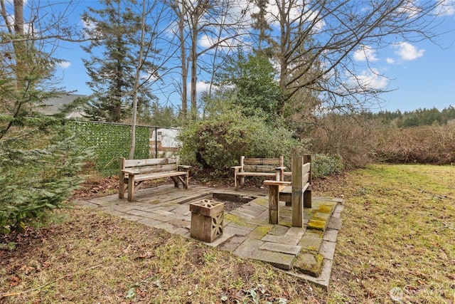 view of yard featuring fence and a patio