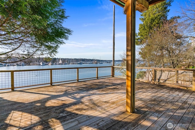 wooden terrace with a water view