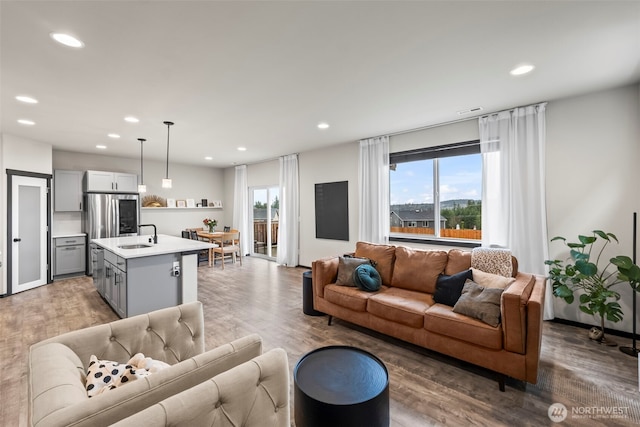 living area featuring recessed lighting and wood finished floors