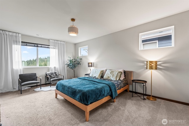 carpeted bedroom with baseboards