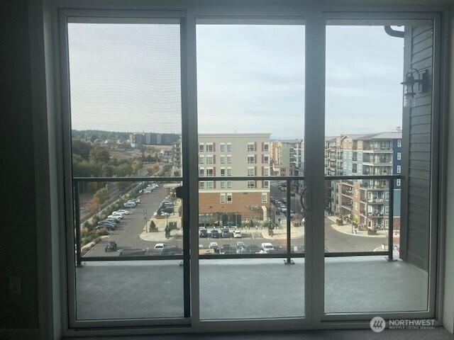 doorway to outside featuring a city view