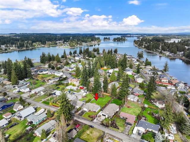 birds eye view of property featuring a residential view and a water view