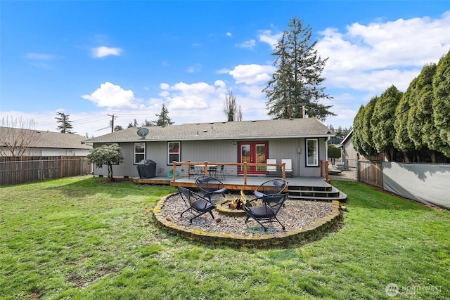 back of house featuring french doors, a wooden deck, and a fenced backyard