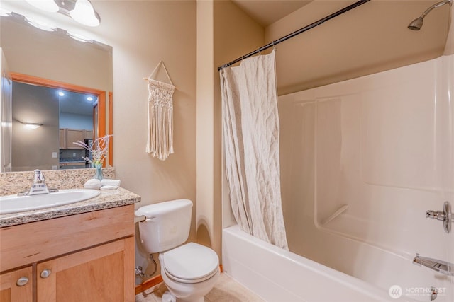 bathroom featuring vanity, toilet, and shower / tub combo with curtain