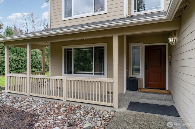 property entrance featuring covered porch