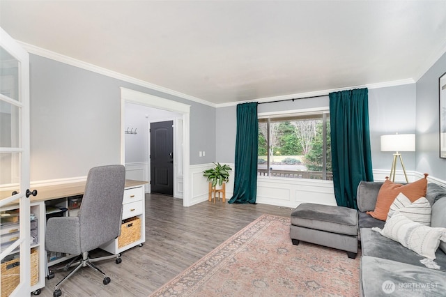 office featuring a wainscoted wall, wood finished floors, and crown molding