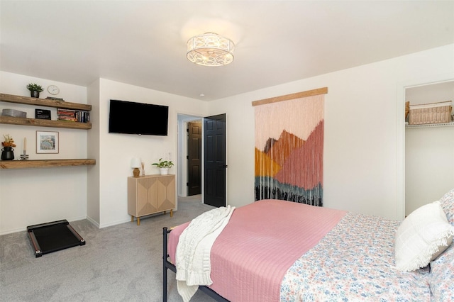 bedroom with carpet floors and baseboards