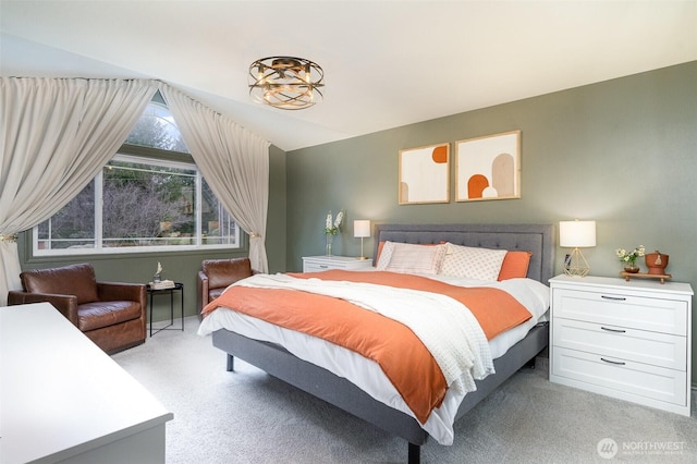 bedroom featuring light colored carpet