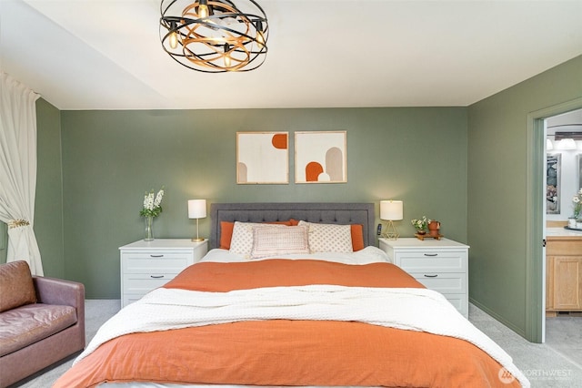 bedroom featuring light carpet and baseboards