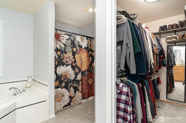 walk in closet featuring tile patterned flooring