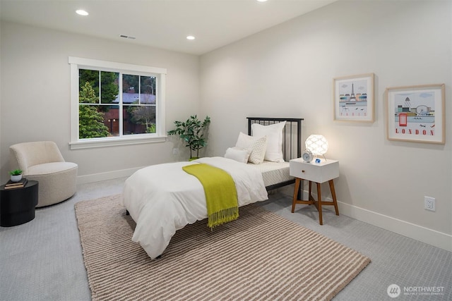 carpeted bedroom with recessed lighting, visible vents, and baseboards